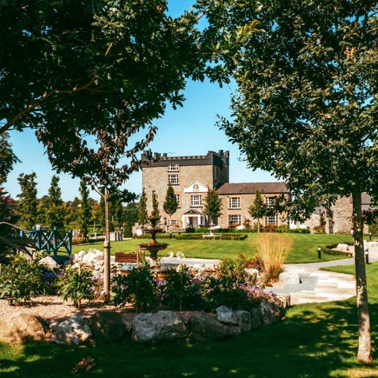 darver-castle-view-past-greenery